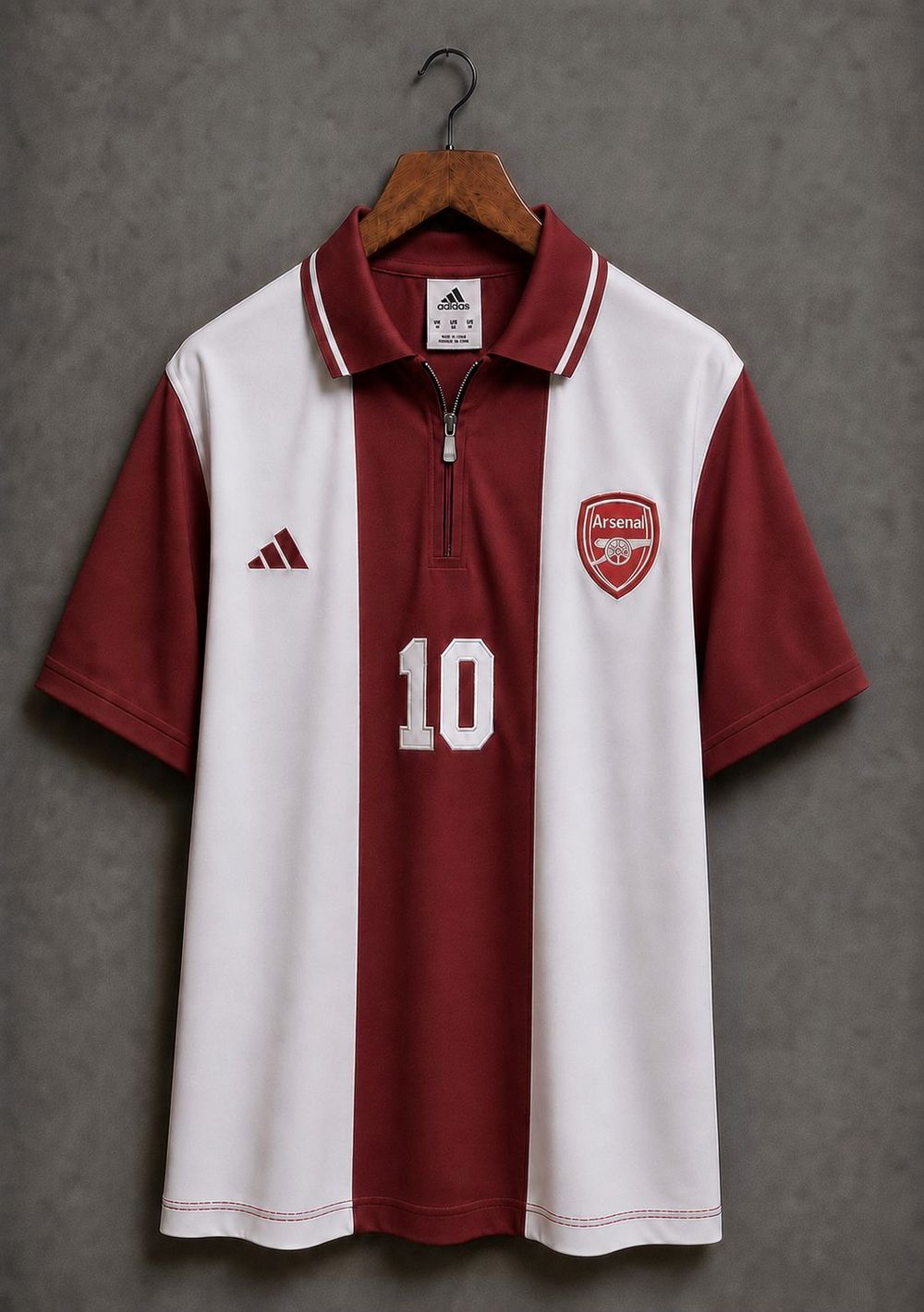 Arsenal red and white shirt with a zipped polo collar, squad number 10 on the front.